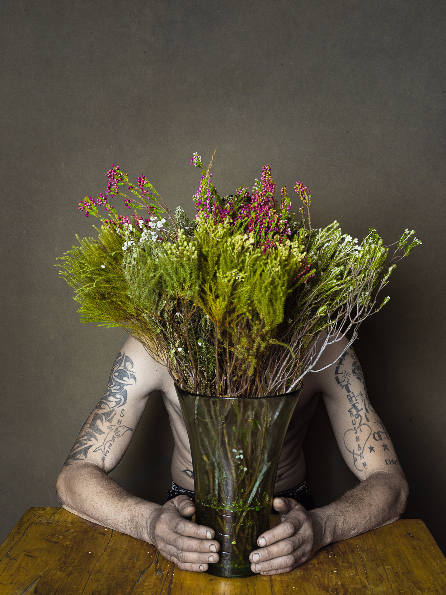 Man with Vase and tattoos flowers still life by Thabit 